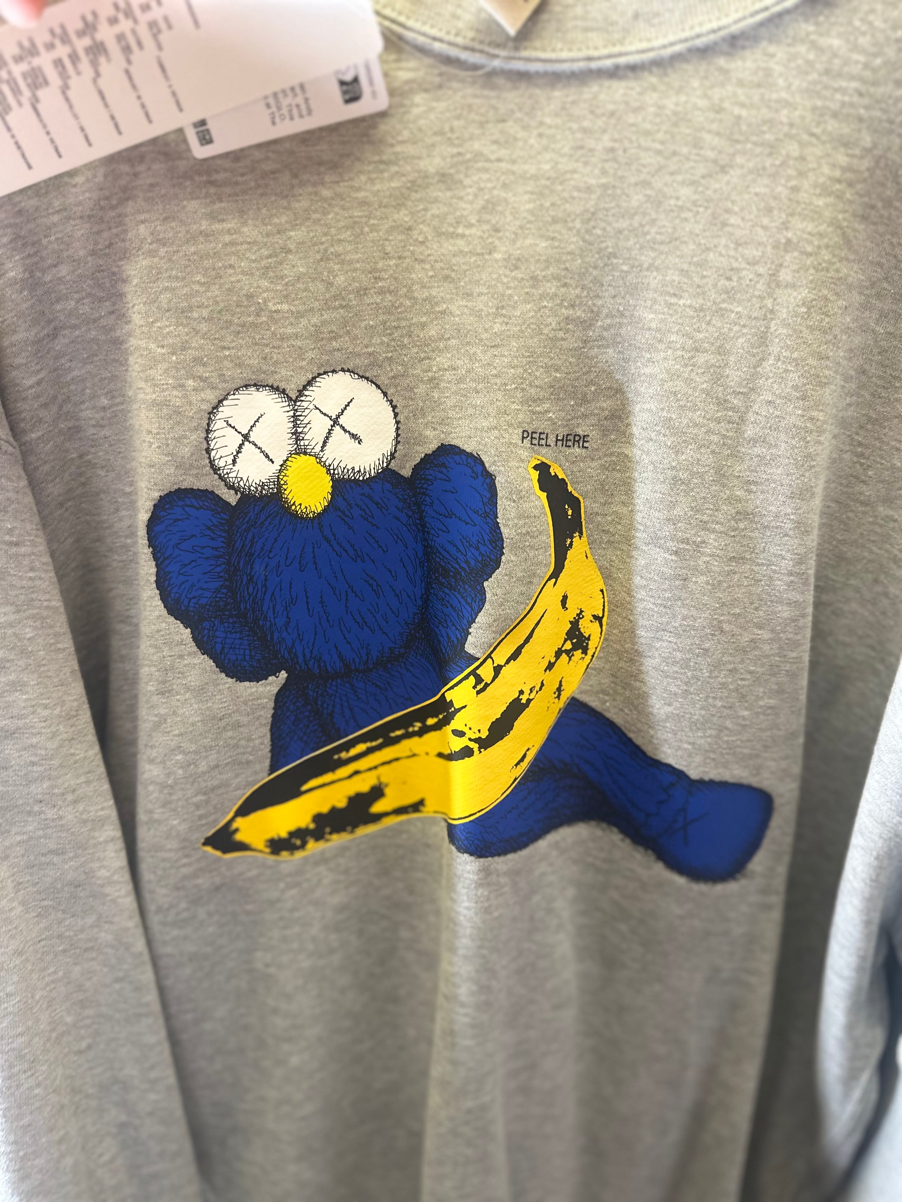 Uniqlo x Kaws sweatshirt”Peel Here” brand new